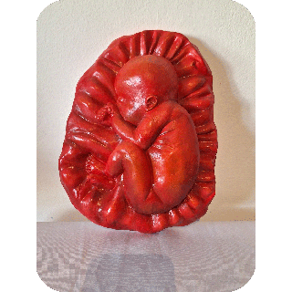 Fruto de la vida bajo relieve escultura