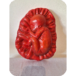 Fruto de la vida bajo relieve escultura