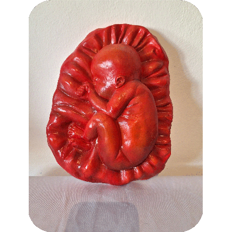 Fruto de la vida bajo relieve escultura