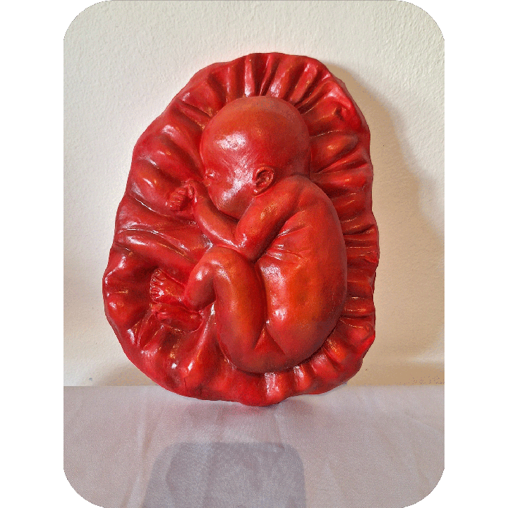 Fruto de la vida bajo relieve escultura